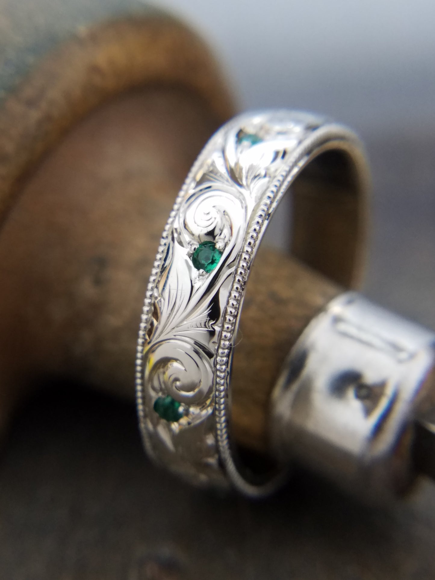 Engraved scroll wedding band with gemstone